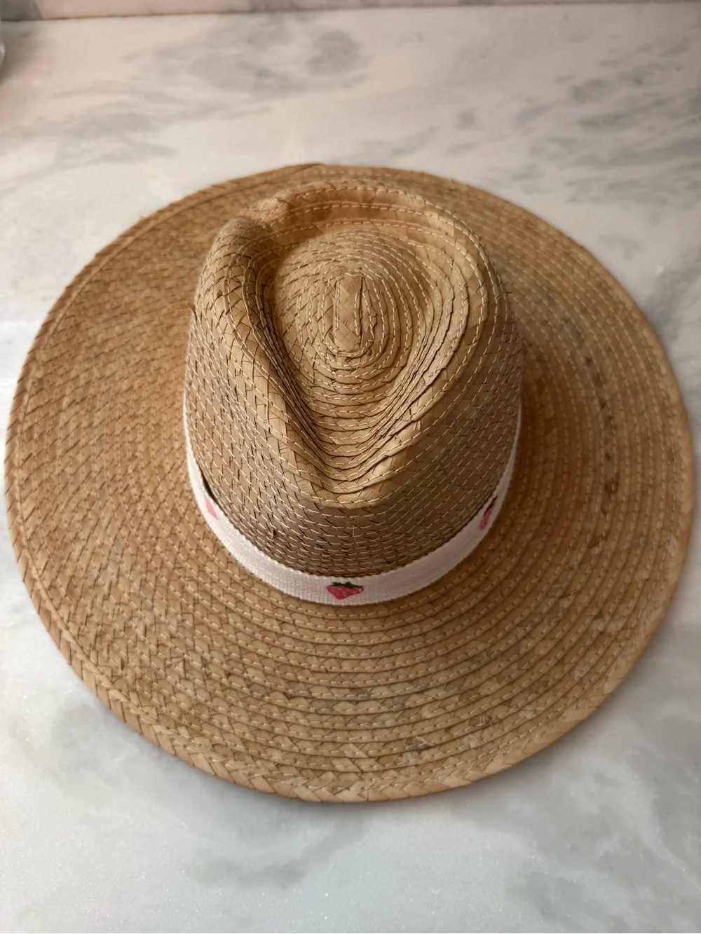 Wide brim straw hat with strawberry trim